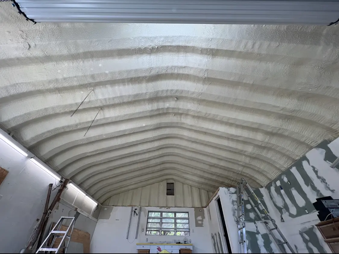 Spray polyurethane foam applied to the underside of a metal roof deck in Big Spring